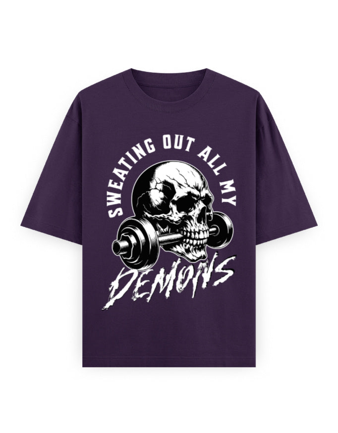 Purple t-shirt with a skull and barbell graphic and text on a white background