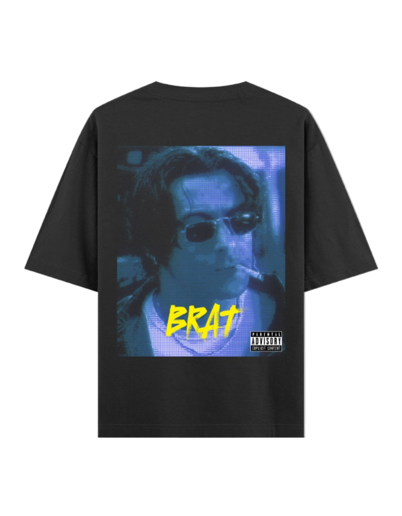 White unisex oversized t-shirt featuring large glitch-style graphic of man in blue tone with yellow "BRAT" text and Parental Advisory label – hip-hop inspired edgy design