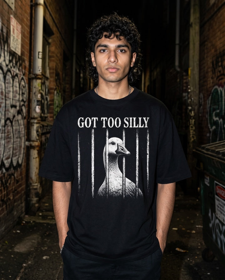 Frolic Saga black 100% cotton oversized t-shirt with a graphic print of a goose behind bars and the text "GOT TOO SILLY".