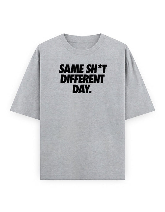 Frolic Saga grey 100% cotton oversized t-shirt with black text graphic 'SAME SH*T DIFFERENT DAY.'