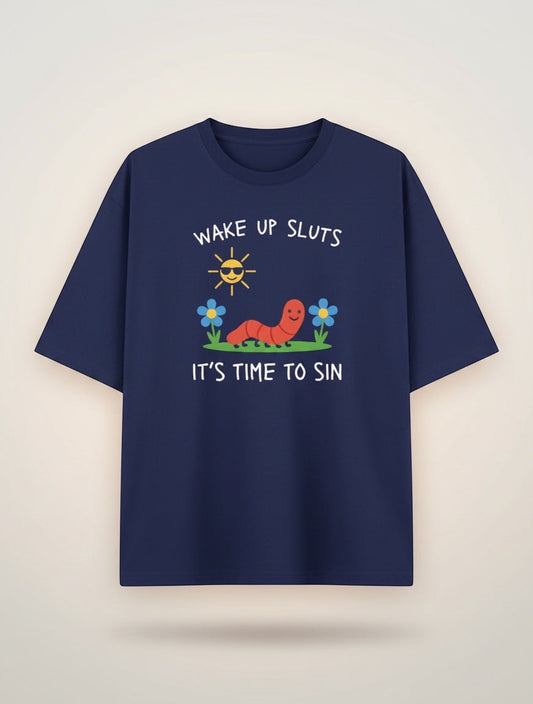 Frolic Saga navy blue 100% cotton oversized t-shirt with a graphic print of a smiling worm, sunglasses-wearing sun, and flowers. Text reads "WAKE UP SLUTS IT'S TIME TO SIN."