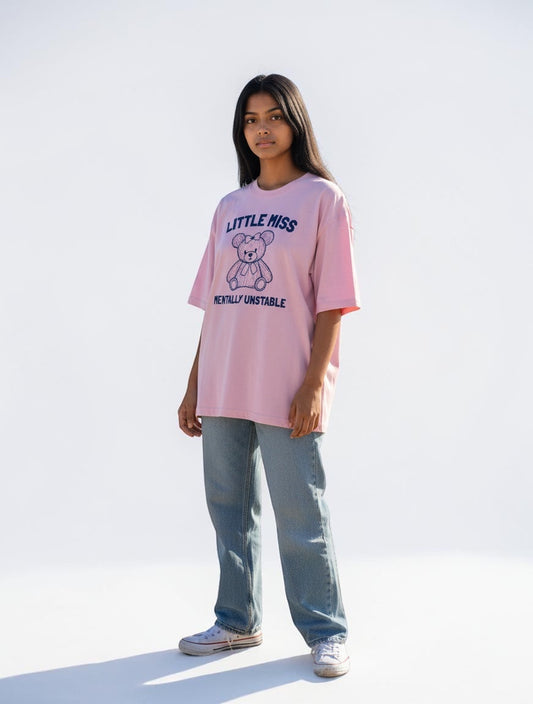 Frolic Saga pink oversized cotton t-shirt with a navy graphic of a teddy bear and text "Little Miss Mentally Unstable".