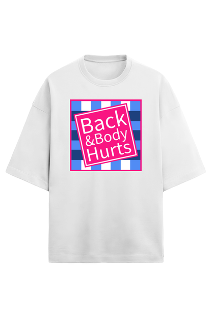 White unisex oversized French Terry T-shirt in 280 GSM cotton featuring a humorous pink and blue square graphic with the text “Back & Body Hurts”