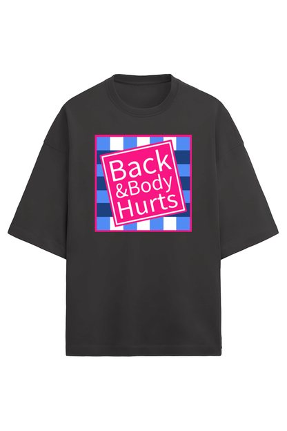 black unisex oversized French Terry T-shirt in 280 GSM cotton featuring a humorous pink and blue square graphic with the text “Back & Body Hurts”
