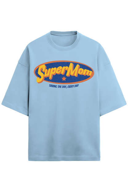 baby blue oversized women’s T-shirt in 280 GSM French Terry cotton with a retro comic-style “SuperMom” print and the phrase “Saving the Day, Every Day”