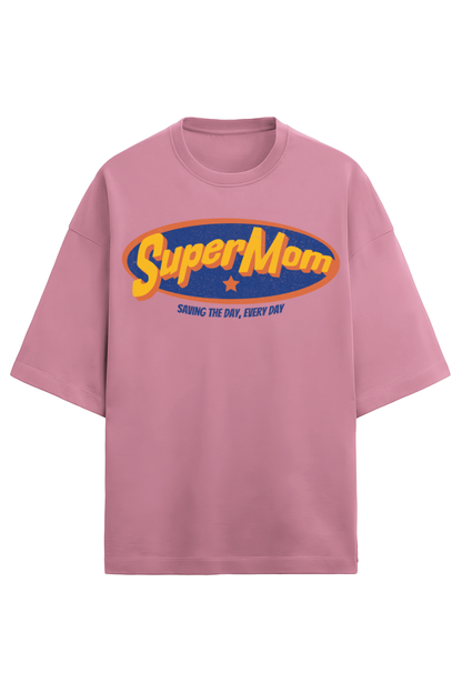 baby pink oversized women’s T-shirt in 280 GSM French Terry cotton with a retro comic-style “SuperMom” print and the phrase “Saving the Day, Every Day”