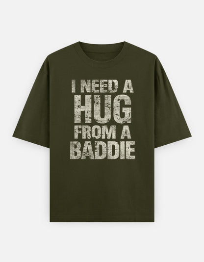 Green t-shirt with text 'I Need a Hug from a Baddie' on a white background