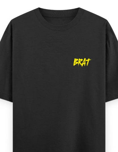 Black unisex oversized t-shirt with yellow "BRAT" text on left chest – minimalist streetwear style in 240 GSM cotton