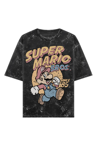 Unisex acid washed black oversized T-shirt with vintage Super Mario Bros graphic and “Since ‘85” text, made from 240 GSM 100% cotton