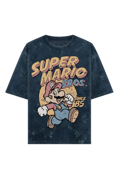 Unisex acid washed navy blue oversized T-shirt with vintage Super Mario Bros graphic and “Since ‘85” text, made from 240 GSM 100% cotton