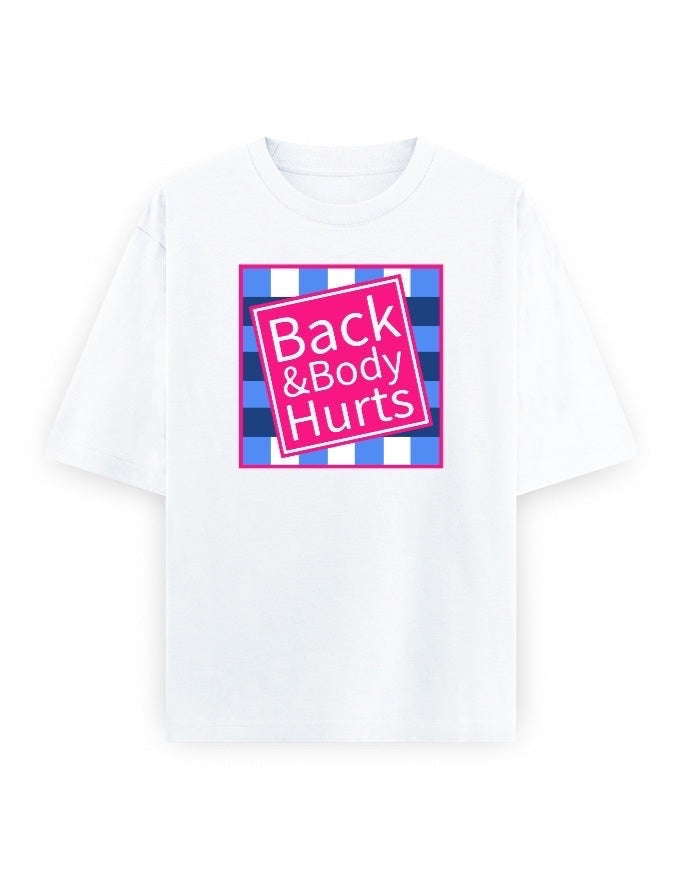 Frolic Saga white oversized 100% cotton t-shirt with a pink graphic that says "Back & Body Hurts" on a blue and white checkered background.