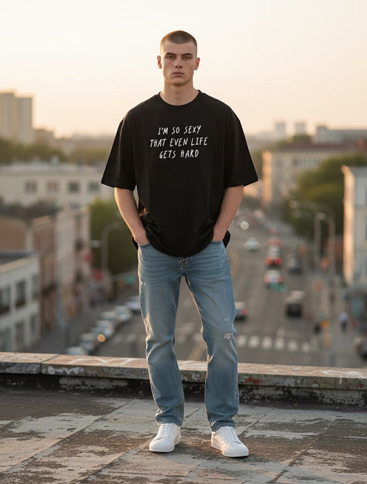 Frolic Saga unisex oversized black 100% cotton t-shirt with white text graphic and relaxed fit.
