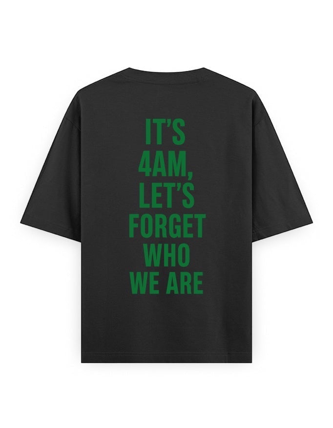 Frolic Saga black 100% cotton oversized t-shirt with green text graphic on back reading "IT'S 4AM, LET'S FORGET WHO WE ARE".
