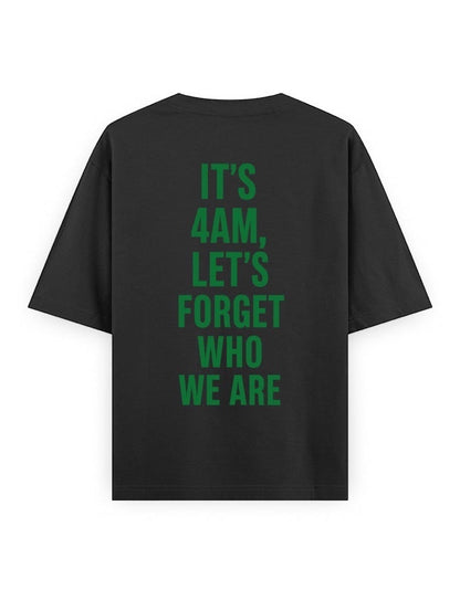 Frolic Saga black 100% cotton oversized t-shirt with green text graphic on back reading "IT'S 4AM, LET'S FORGET WHO WE ARE".