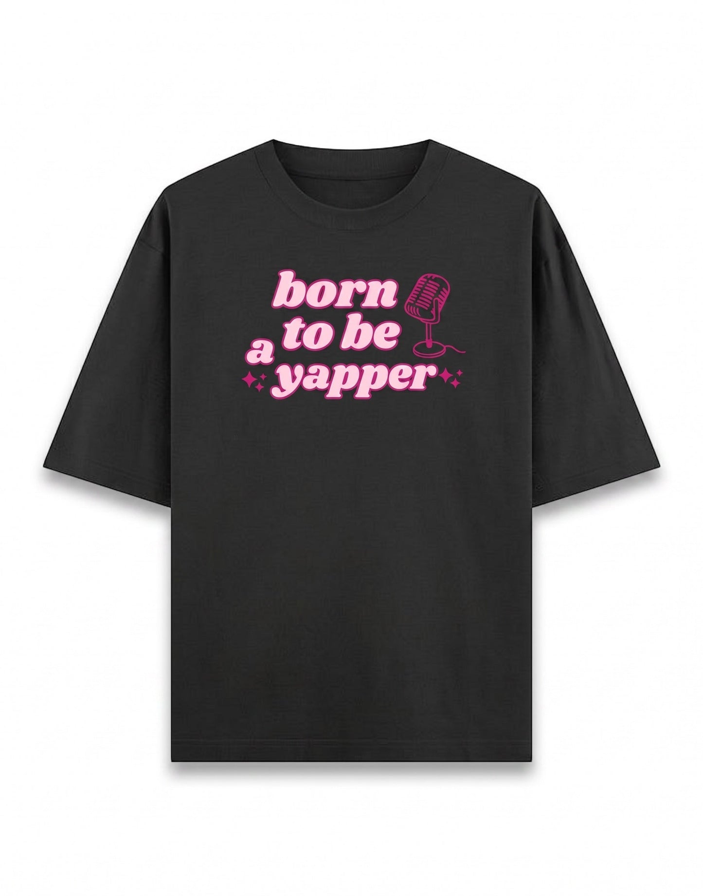Frolic Saga Unisex oversized classic black 100% cotton t-shirt with pink "born to be a yapper" graphic and microphone.