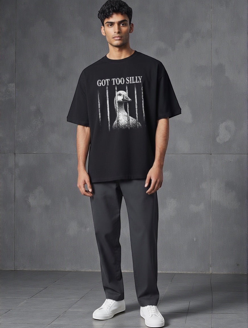 Frolic Saga black 100% cotton oversized t-shirt with "GOT TOO SILLY" graphic and goose behind bars.