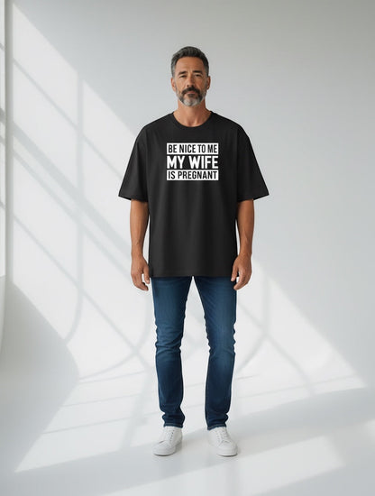 Frolic Saga black 100% cotton oversized t-shirt with "BE NICE TO ME MY WIFE IS PREGNANT" graphic print.