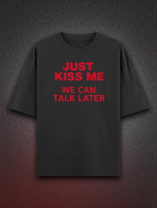 Frolic Saga black 100% cotton oversized t-shirt with red text graphic "JUST KISS ME WE CAN TALK LATER"