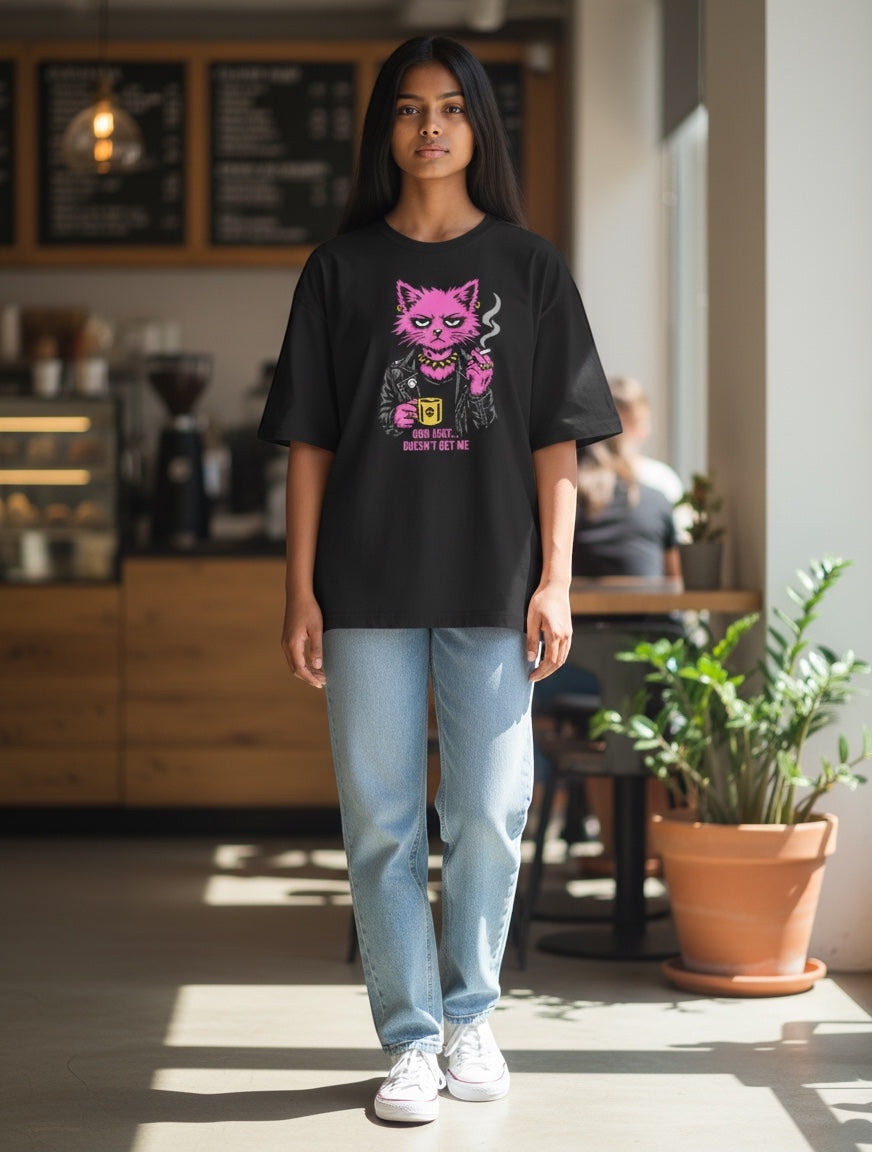 Frolic Saga black oversized cotton t-shirt with a punk cat graphic and text "God Just Doesn't Get Me".