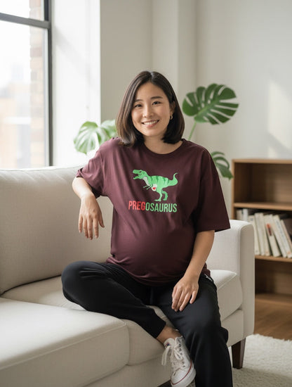 Frolic Saga burgundy 100% cotton oversized t-shirt with "PREGOSAURUS" dinosaur graphic for maternity wear.