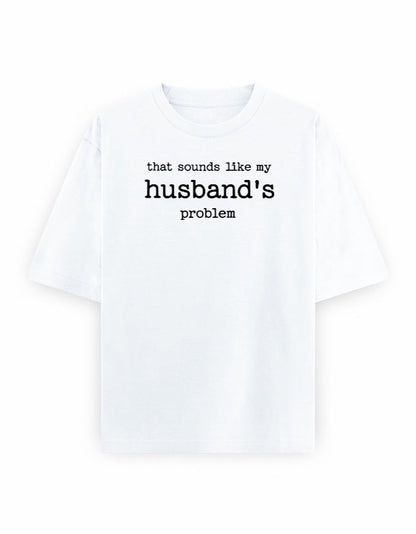 Frolic Saga white 100% cotton oversized t-shirt with black text graphic that says "that sounds like my husband's problem."