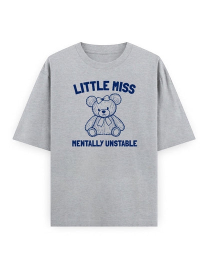 Frolic Saga grey oversized cotton t-shirt with a navy blue graphic of a teddy bear and text "Little Miss Mentally Unstable".