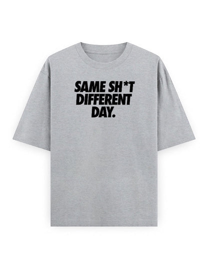 Frolic Saga grey 100% cotton oversized t-shirt with black text graphic 'SAME SH*T DIFFERENT DAY.'