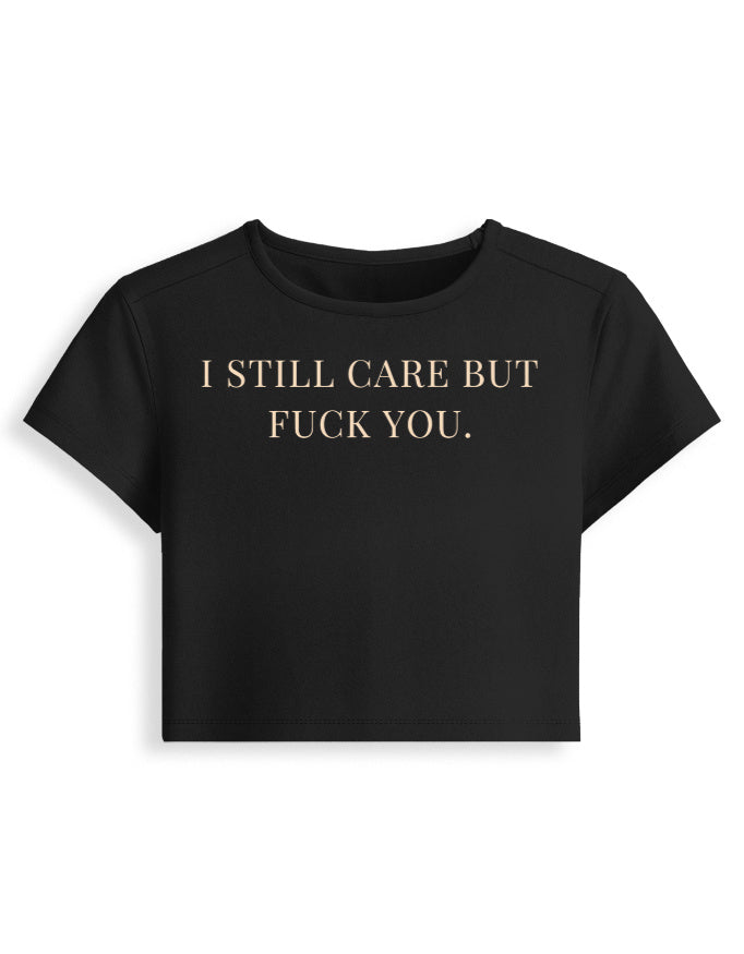 I Still Care But F*ck You black cropped baby tee front, typography graphic - Frolic Saga