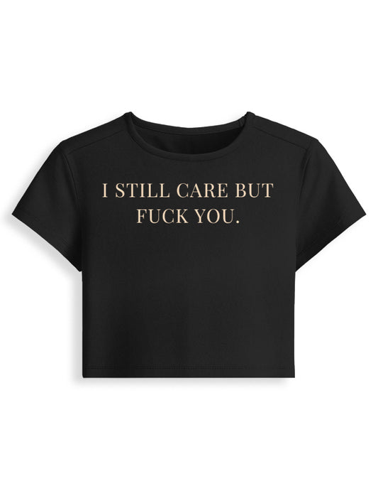 I Still Care But F*ck You black cropped baby tee front, typography graphic - Frolic Saga