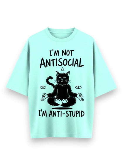 Frolic Saga unisex oversized t-shirt in mint green, 100% cotton, featuring a black graphic of a meditating cat with text "I'M NOT ANTISOCIAL I'M ANTI-STUPID".