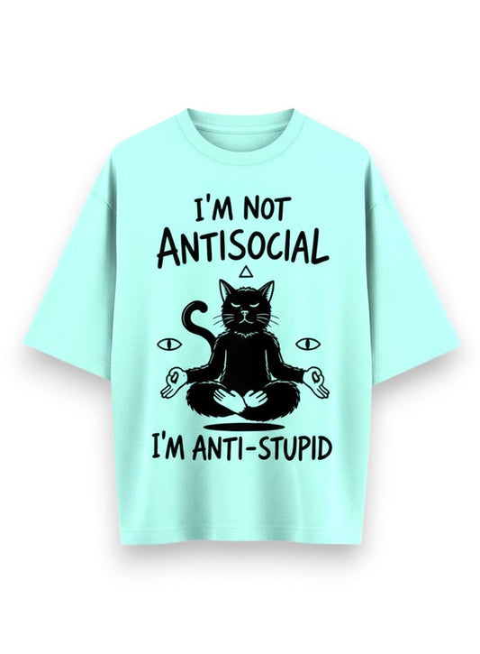 Frolic Saga unisex oversized t-shirt in mint green, 100% cotton, featuring a black graphic of a meditating cat with text "I'M NOT ANTISOCIAL I'M ANTI-STUPID".