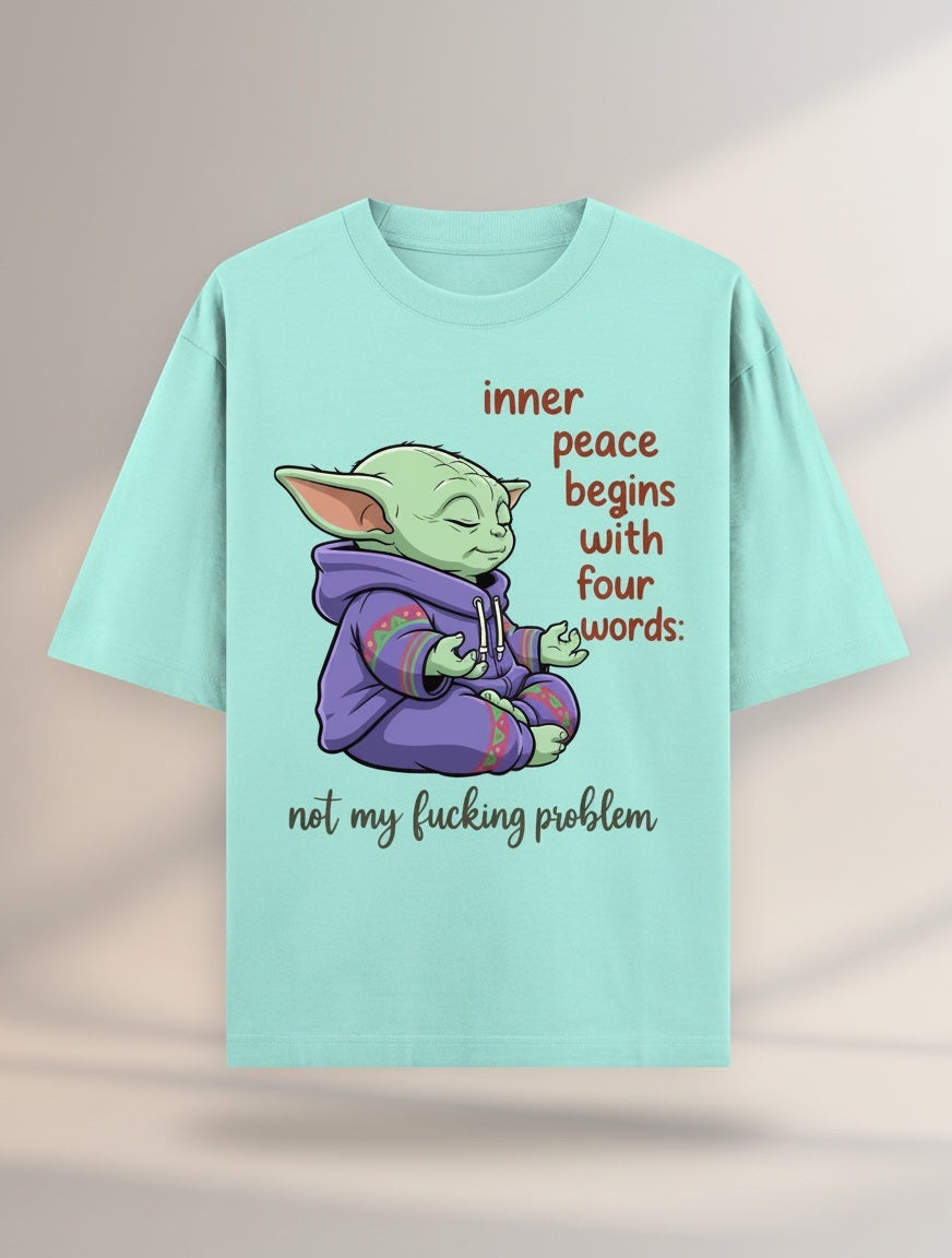 Frolic Saga unisex oversized t-shirt in mint green, 100% cotton, featuring a graphic of Yoda meditating with text "inner peace begins with four words: not my fucking problem."