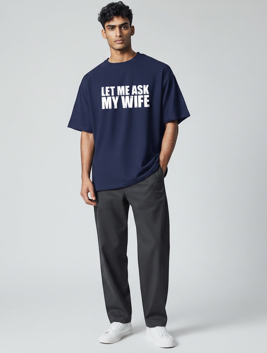Frolic Saga navy blue oversized t-shirt with white 'Let Me Ask My Wife' graphic print on chest, made of 100% cotton.