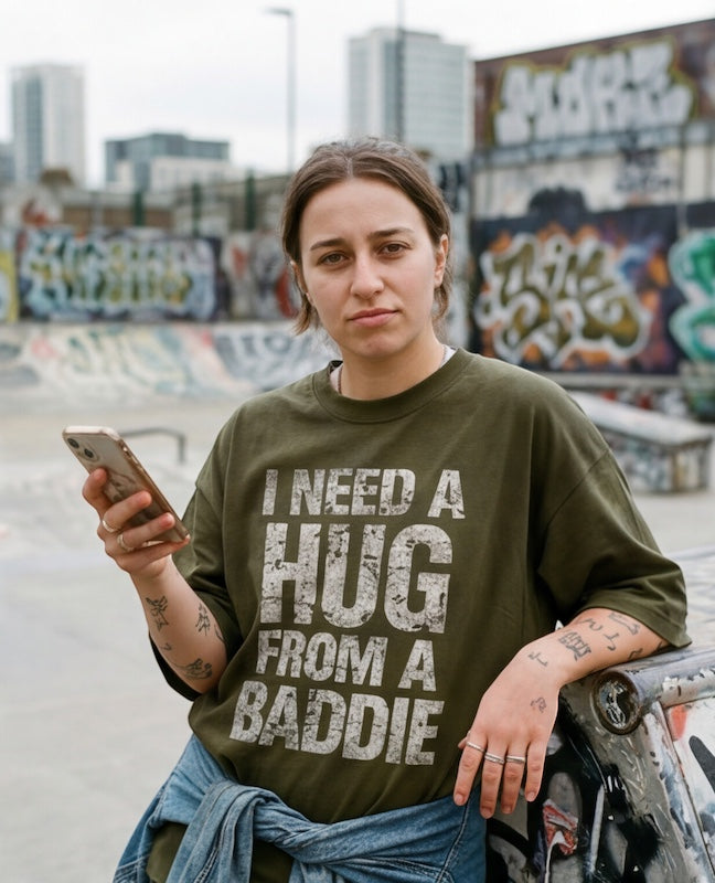Frolic Saga olive green 100% cotton oversized t-shirt with distressed "I Need A Hug From A Baddie" slogan.