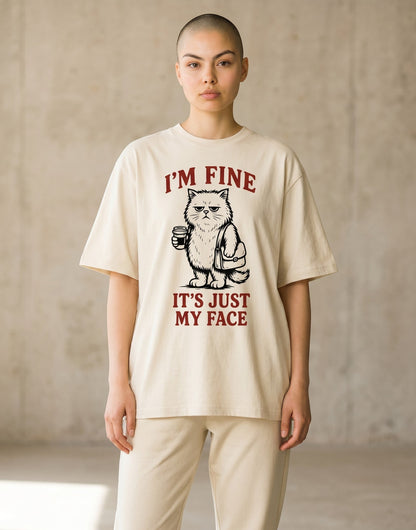 Frolic Saga unisex oversized beige cotton t-shirt with a grumpy cat graphic and I'm Fine text on a model.