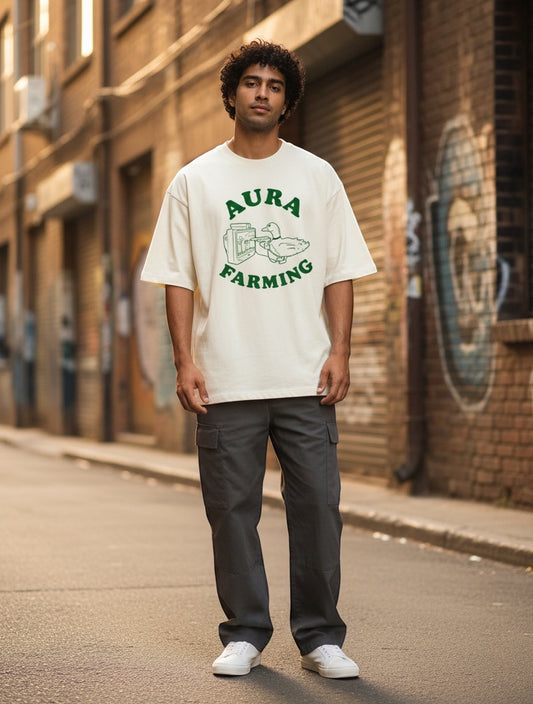 Frolic Saga Unisex oversized classic t-shirt in cream 100% cotton with green Aura Farming graphic print.