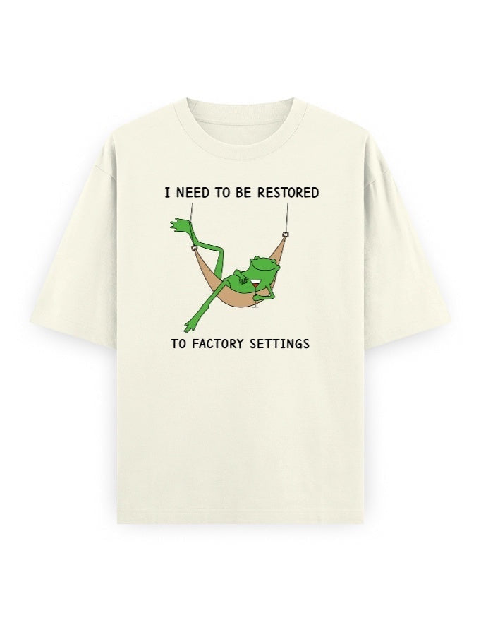 Frolic Saga cream 100% cotton oversized t-shirt with a graphic of a frog in a hammock and text.
