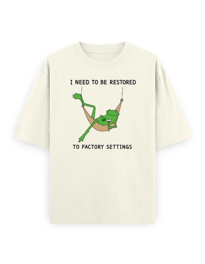 Frolic Saga cream 100% cotton oversized t-shirt with a graphic of a frog in a hammock and text.
