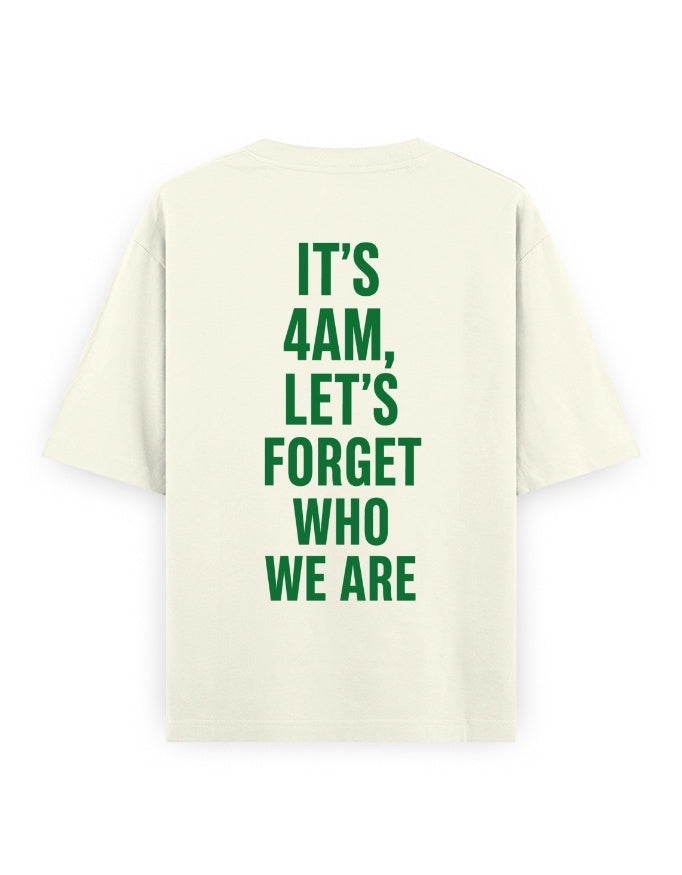 Frolic Saga cream 100% cotton oversized t-shirt with green text graphic on back reading "IT'S 4AM, LET'S FORGET WHO WE ARE."