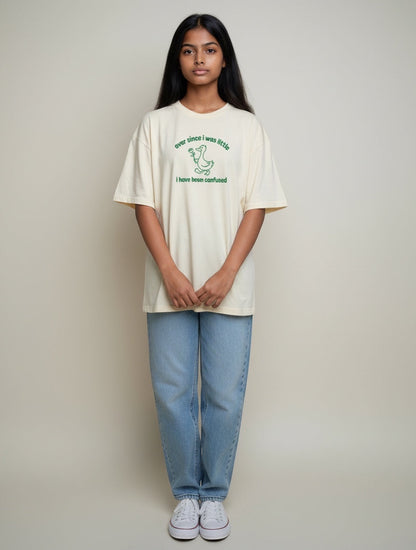 Frolic Saga off-white oversized cotton t-shirt with green line-drawn duck holding a rose and text.
