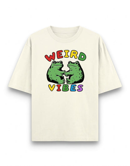 Frolic Saga cream oversized cotton t-shirt with Weird Vibes graphic featuring two green frogs in colorful text.