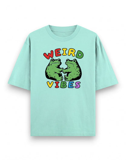 Frolic Saga mint green oversized cotton t-shirt with a graphic of two frogs and the text Weird Vibes.