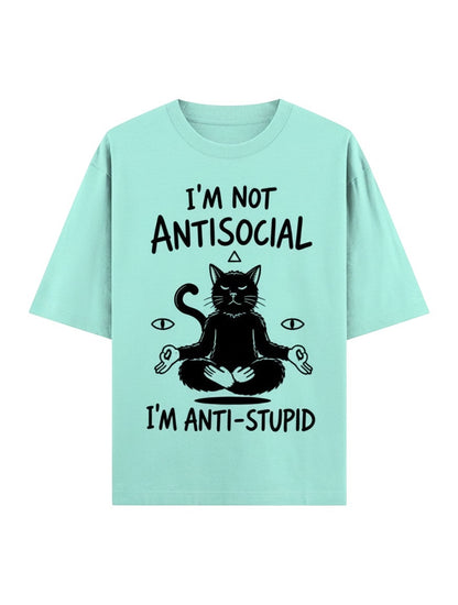Frolic Saga unisex oversized mint green 100% cotton t-shirt with a black graphic of a meditating cat and text.