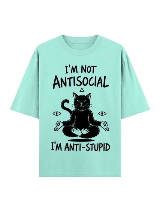 Frolic Saga unisex oversized mint green 100% cotton t-shirt with a black graphic of a meditating cat and text.