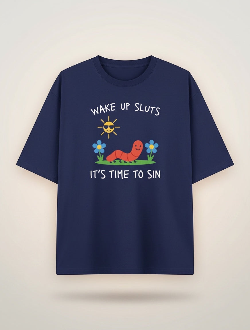 Frolic Saga navy blue 100% cotton oversized t-shirt with a graphic print of a smiling worm, sunglasses-wearing sun, and flowers. Text reads "WAKE UP SLUTS IT'S TIME TO SIN."