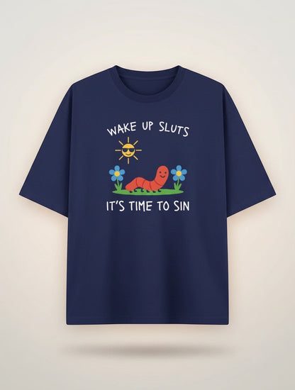 Frolic Saga navy blue 100% cotton oversized t-shirt with a graphic print of a smiling worm, sunglasses-wearing sun, and flowers. Text reads "WAKE UP SLUTS IT'S TIME TO SIN."