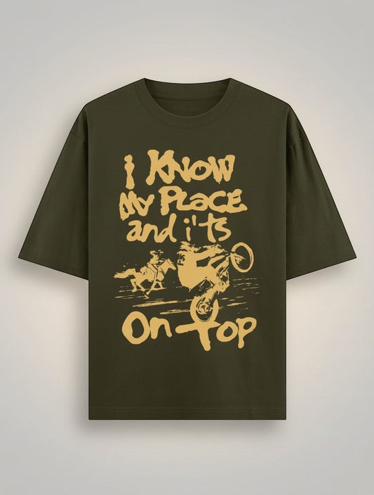 Frolic Saga Unisex oversized classic t-shirt in olive green, 100% cotton with a graphic print.