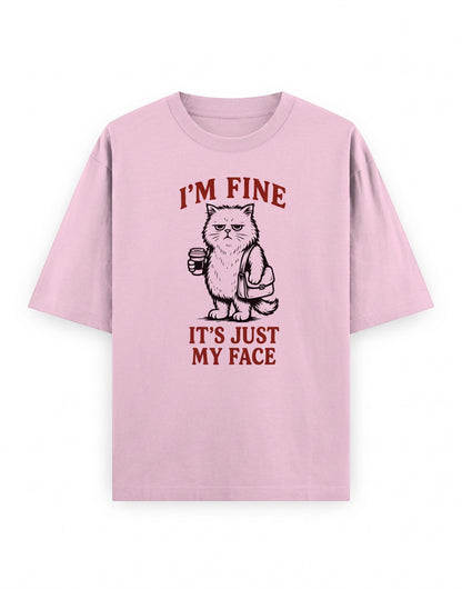 Frolic Saga light pink oversized cotton t-shirt featuring a grumpy cat graphic with the text I'M FINE IT'S JUST MY FACE