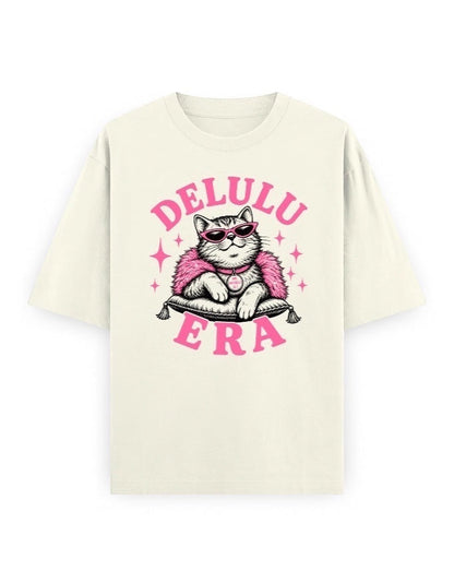Frolic Saga Unisex oversized classic t-shirt in cream, 100% cotton, featuring a graphic of a cat wearing sunglasses and a pink fluffy boa.