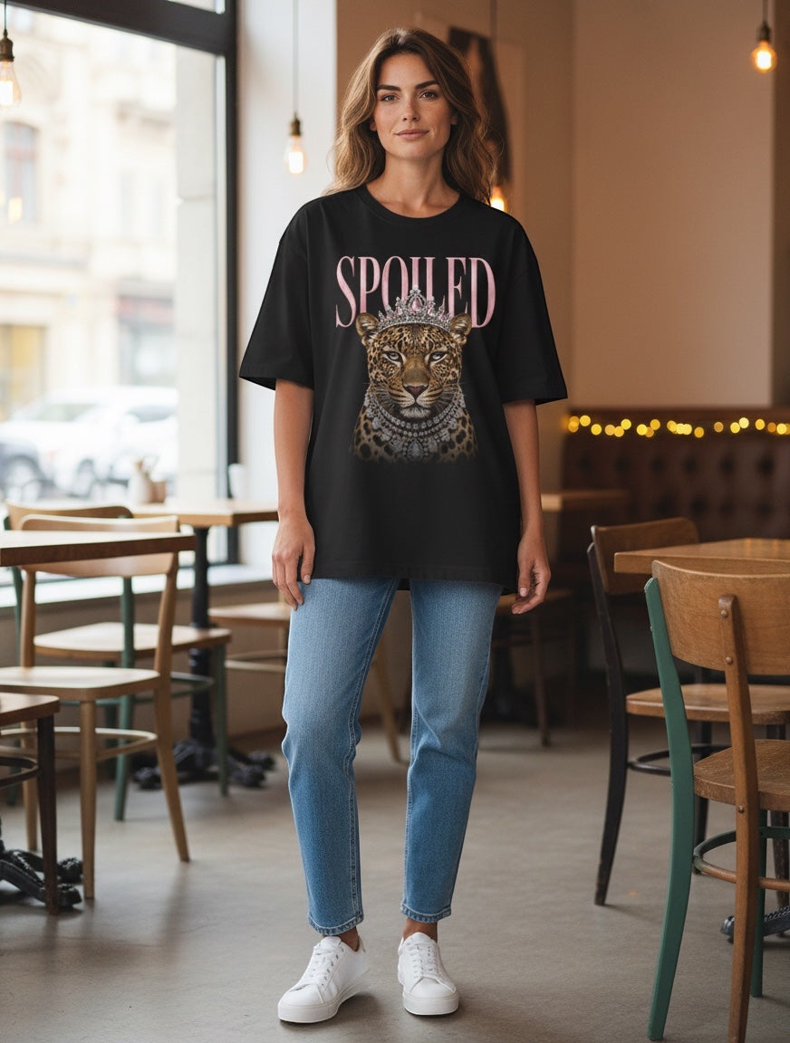 Frolic Saga black 100% cotton oversized t-shirt with a graphic of a leopard wearing a crown and jewels, and the word "SPOILED" above.